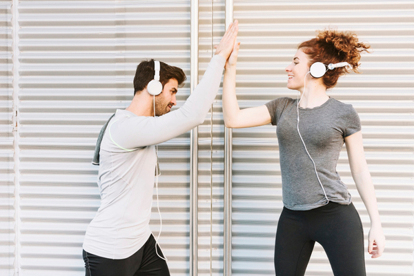 Sporty-man-and-woman-giving-high-five